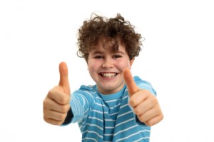 Boy with two thumbs up